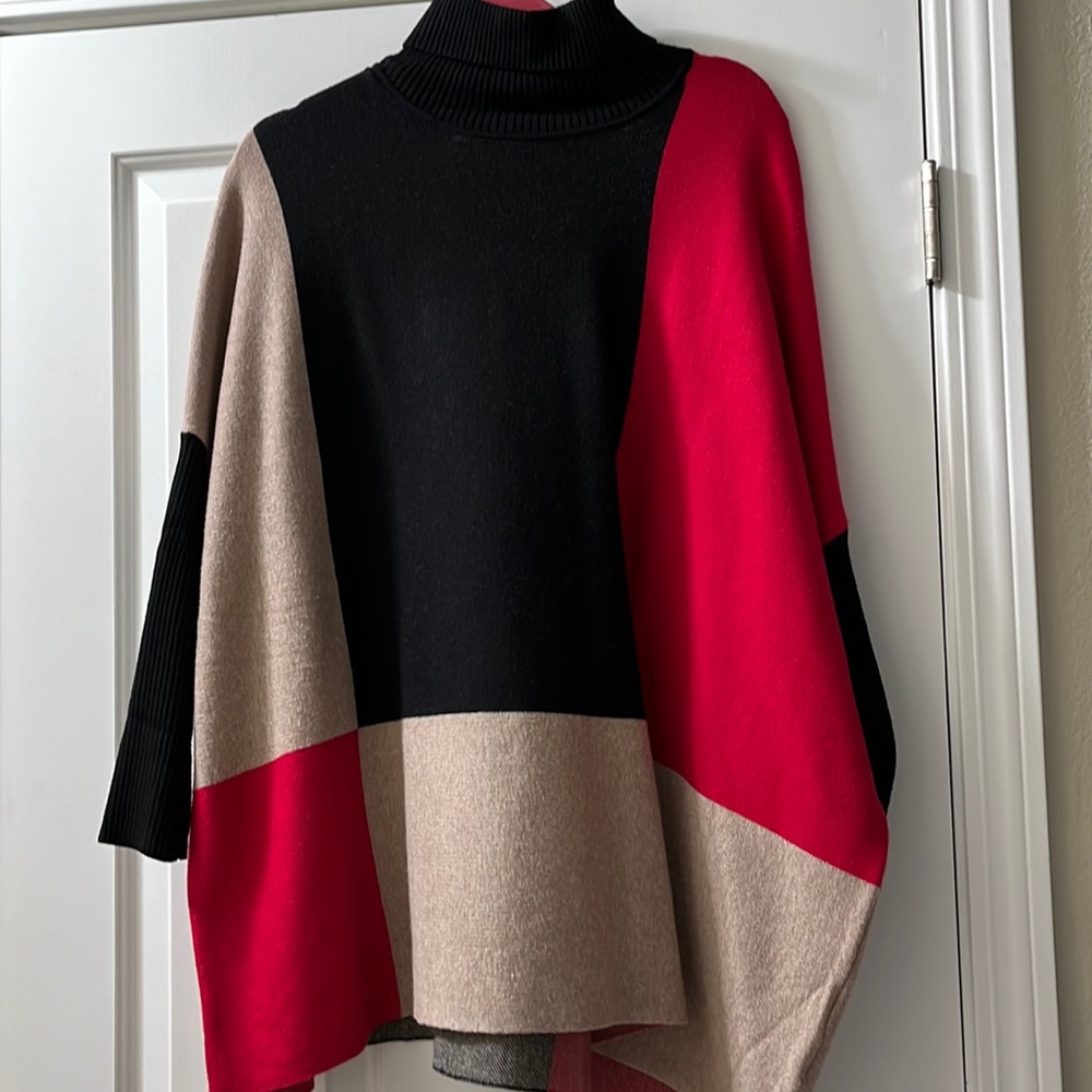 Woman’s Plus poncho style sweater.